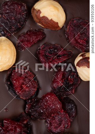 bar of natural dark bitter chocolate with natural whole hazelnuts and cranberries 93950106