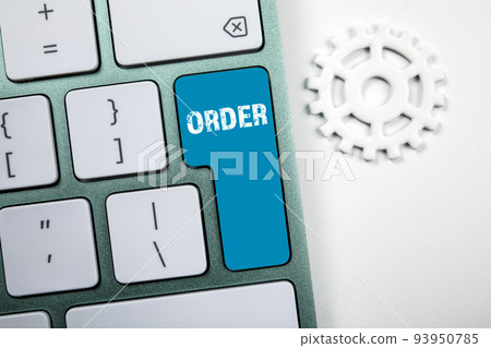 Order. White computer keyboard with blue button 93950785