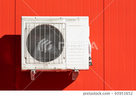 outdoor air conditioner unit on the wall of a building outdoor air conditioner unit on the wall of a building 93951652