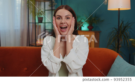 Excited young woman surprised, shocked by sudden victory, good win news, celebrating, wow reaction 93952355