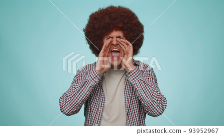 Expressive man holding hands near mouth loudly screaming, shouting, yelling announces discounts sale 93952967
