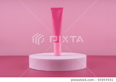 Pink cosmetic product on podium pedestal. Facial cream mockup on pink background, lotion in dispenser for woman skincare routine. Beauty moisturiser packaging. Lotion presentation 93954591