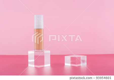 Cosmetic liquid foundation nude cream bottle mockup on acrylic block podium pedestal. Beige concealer base cosmetics product mock up on pink. Skincare beauty primer, bb cc corrector Cosmetic liquid foundation nude cream bottle mockup on acrylic block podium pedestal. Beige concealer base cosmetics product mock up on pink. Skincare beauty primer, bb cc corrector 93954601