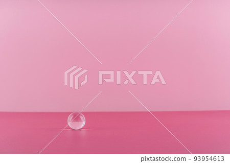 Cosmetic background podium for product presentation. Pink backdrop with transparent sphere decor, display, mockup. Showcase mockup for perfume advertising, cosmetics stand background 93954613