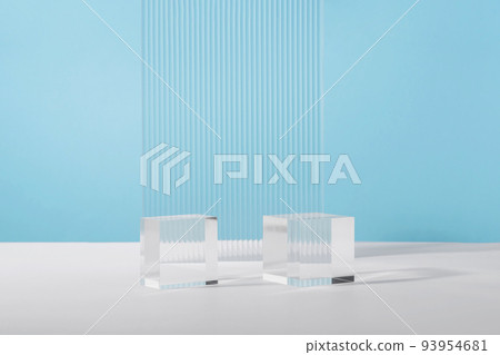Acrylic plate, podium solid blocks, background for cosmetic product packaging on blue with stylish props. Showcase for jewellery presentation, display for advertising, cosmetics branding scene Acrylic plate, podium solid blocks, background for cosmetic product packaging on blue with stylish props. Showcase for jewellery presentation, display for advertising, cosmetics branding scene 93954681