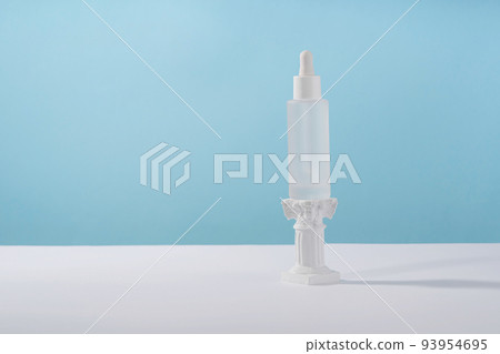 Serum cosmetic bottle with peptides and retinol on podium pedestal on blue background. Hyaluronic acid cosmetics product mock up packaging with stylish props. Serum beauty dropper mockup Serum cosmetic bottle with peptides and retinol on podium pedestal on blue background. Hyaluronic acid cosmetics product mock up packaging with stylish props. Serum beauty dropper mockup 93954695