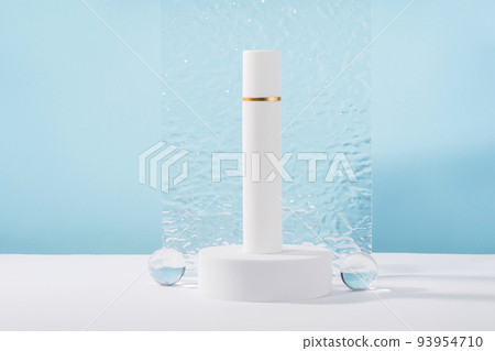 Unbranded cosmetic cream mockup on pedestal podium with stylish props, glass balls and acrylic plate. 93954710