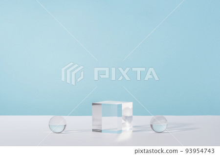 Pedestal cosmetic display glass podium platform with stylish props for product presentation, cosmetics geometric stand, mockup scene for jewellery mock up. Acrylic blocks and balls on blue Pedestal cosmetic display glass podium platform with stylish props for product presentation, cosmetics geometric stand, mockup scene for jewellery mock up. Acrylic blocks and balls on blue 93954743