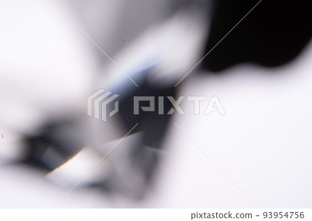 Blue light flare prism rainbow flares overlay effect on black background, light crossing crystals, prismatic sun catcher reflections rays. Abstract blurred colourful lens flare bokeh on dark Blue light flare prism rainbow flares overlay effect on black background, light crossing crystals, prismatic sun catcher reflections rays. Abstract blurred colourful lens flare bokeh on dark 93954756