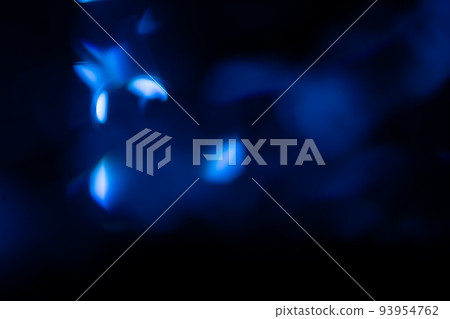 Blue light flare prism rainbow flares overlay effect on black background, light crossing crystals, prismatic sun catcher reflections rays. Abstract blurred colourful lens flare bokeh on dark 93954762