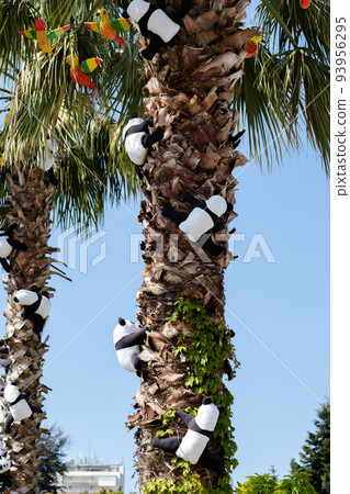 Soft panda toys with parrots decoration on palm trees 93956295