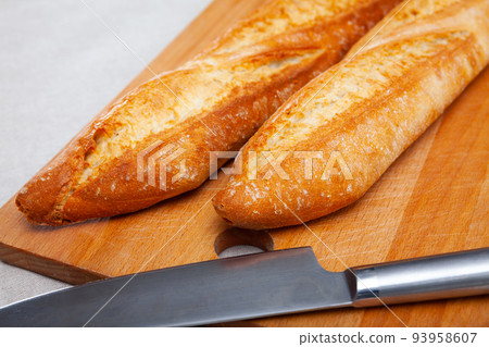 Image of crunchy homemade fresh baked baguettes 93958607