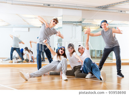 Teens hip hop dancers posing in studio Teens hip hop dancers posing in studio 93958698