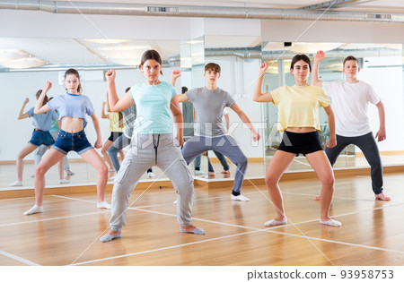 Teenagers are dancing hip hop in dance studio Teenagers are dancing hip hop in dance studio 93958753