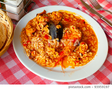 Paella on white plate Paella on white plate 93959197