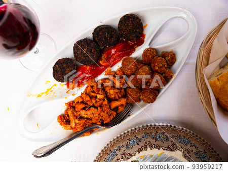 Blood sausage, chorizo, picadillo and roasted peppers Blood sausage, chorizo, picadillo and roasted peppers 93959217
