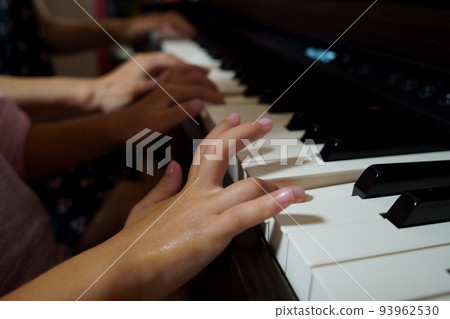 child practicing piano 93962530