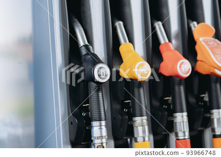 petrol pump filling fuel nozzles at gas station petrol pump filling fuel nozzles at gas station 93966748