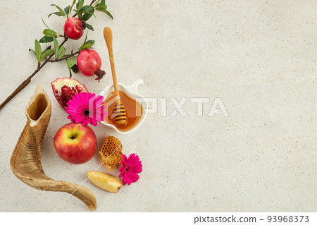 Rosh hashanah, jewish New Year holiday concept. Pomegranate, apples and honey traditional products for celebration 93968373