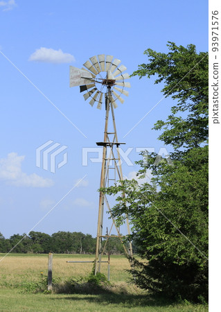 Windmill with sky and grass Windmill with sky and grass 93971576
