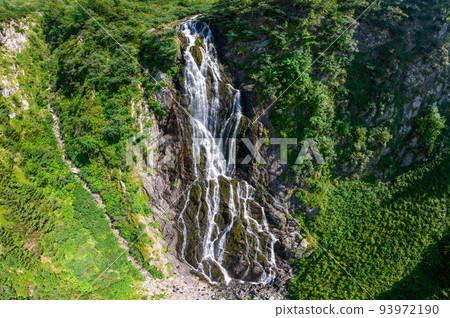 Aerial drone view of waterfall at Transfagarasan route, nature in Romania Aerial drone view of waterfall at Transfagarasan route, nature in Romania 93972190