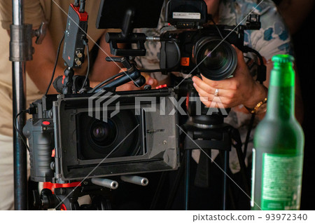 A professional camera on a tripod A professional camera on a tripod 93972340