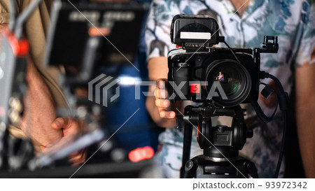 A professional camera on a tripod A professional camera on a tripod 93972342