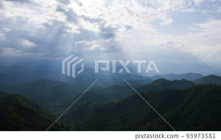 Top view Landscape of Morning Mist with Mountain Layer at north of Thailand. mountain ridge and clouds in rural jungle bush forest Top view Landscape of Morning Mist with Mountain Layer at north of Thailand. mountain ridge and clouds in rural jungle bush forest 93973581
