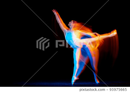 Young and graceful female ballet dancer dancing over dark background in mixed neon light. Art, motion, action, flexibility, inspiration concept. Young and graceful female ballet dancer dancing over dark background in mixed neon light. Art, motion, action, flexibility, inspiration concept. 93975665