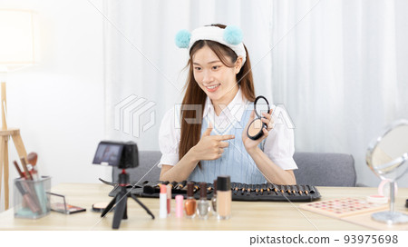 Beautiful women with social media influences recommend products and make-up accessories to be more beautiful, Recording vlog video live streaming, Online business of beauty bloggers.  93975698