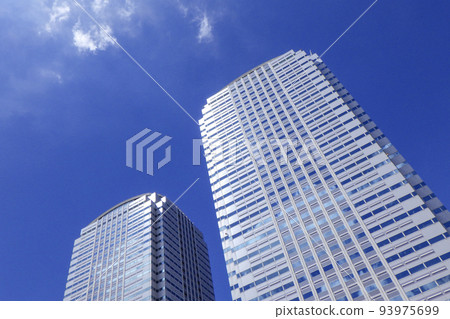 High-rise office building against the blue sky 93975699