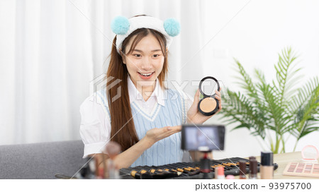 Beautiful women with social media influences recommend products and make-up accessories to be more beautiful, Recording vlog video live streaming, Online business of beauty bloggers.  93975700