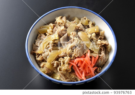 A simple and hot beef bowl with red ginger on a black background 93976763