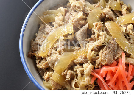 A simple and hot beef bowl with red ginger on a black background A simple and hot beef bowl with red ginger on a black background 93976774