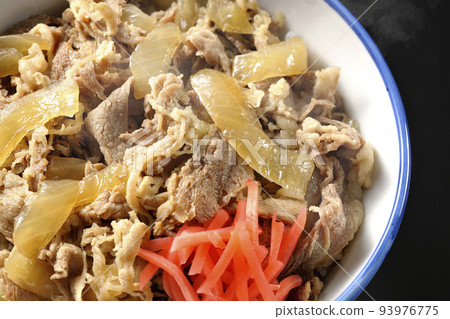 A simple and hot beef bowl with red ginger on a black background 93976775