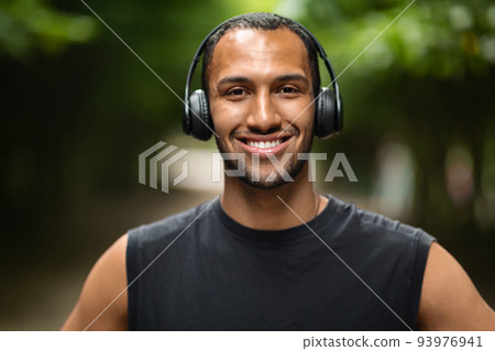 Closeup portrait of african american young athlete training in park Closeup portrait of african american young athlete training in park 93976941