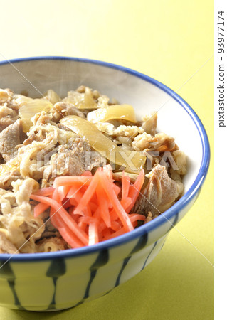 Simple hot beef bowl topped with red pickled ginger Simple hot beef bowl topped with red pickled ginger 93977174