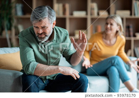 Relationship Problems. Portrait Of Middle Aged Spouses Arguing At Home 93978170