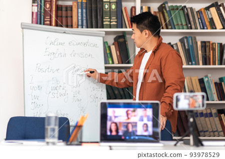 Japanese Male Tutor Having Online Lesson Making Video Call Indoor Japanese Male Tutor Having Online Lesson Making Video Call Indoor 93978529