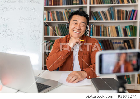 Japanese Teacher Man Having Lecture Via Video Call In Classroom Japanese Teacher Man Having Lecture Via Video Call In Classroom 93979274
