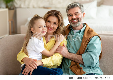Happy Family With Little Daughter Posing Embracing At Home Happy Family With Little Daughter Posing Embracing At Home 93980388