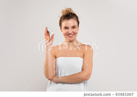 Portrait Of Beautiful Middle Aged Female Holding Hygienic Lipstick And Smiling Portrait Of Beautiful Middle Aged Female Holding Hygienic Lipstick And Smiling 93981007