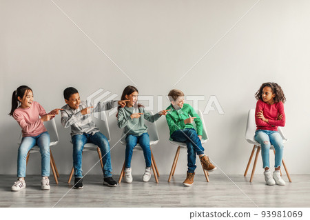 Preteen Children Laughing Bullying Victimized Black Schoolgirl In Classroom 93981069