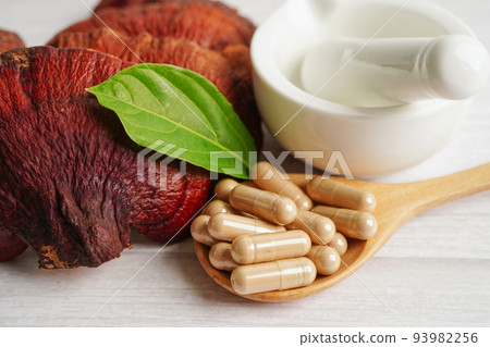 Lingzhi or Reishi mushroom with capsules, organic natural healthy food. 93982256