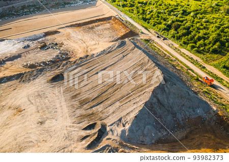 Quarry for mining of natural resources on the hill close to the forest, aerial view Quarry for mining of natural resources on the hill close to the forest, aerial view 93982373