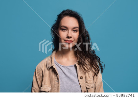 Portrait of smiling friendly pretty millennial caucasian brunette lady in casual, look at camera Portrait of smiling friendly pretty millennial caucasian brunette lady in casual, look at camera 93982741