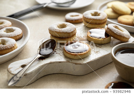 Cooking cookies process. Homemade linzer cookies with chocolate. Cooking cookies process. Homemade linzer cookies with chocolate. 93982946