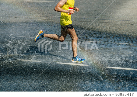 athlete runner run water splashes and rainbow 93983417