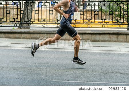 athletic male runner running marathon race athletic male runner running marathon race 93983428
