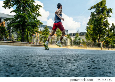 male runner athlete running street marathon male runner athlete running street marathon 93983430